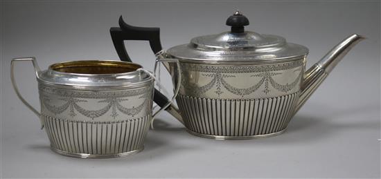 A Victorian silver swag-engraved teapot and matched sugar bowl, London 1884-5, makers Holland, Son & Slater, gross 19oz